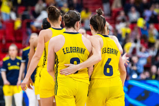 Elin Eldebrink and Frida Eldebrink of Sweden look dejected