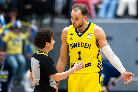 Denzel Andersson of Sweden in discussion with the referee