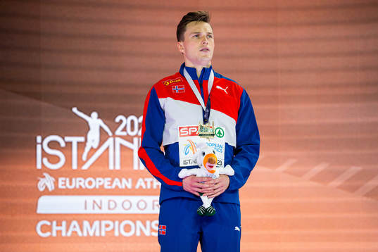 Karsten Warholm of Norway with his gold medal at the medal