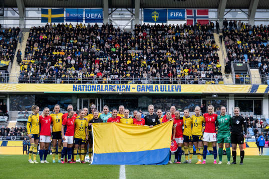 Players of Sweden and of Norway pose for a photo with the