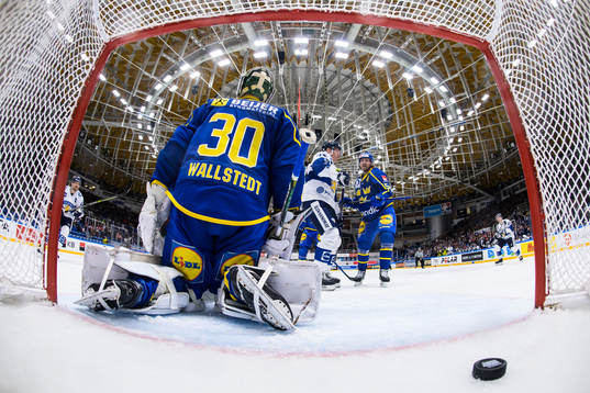 Goaltender Jesper Wallstedt of Sweden looks dejected