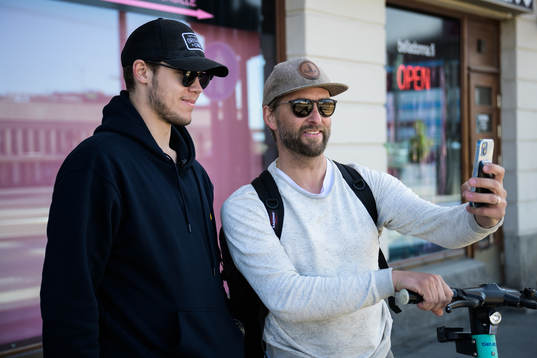 A man takes a selfie with goaltender Jesper Wallstedt of