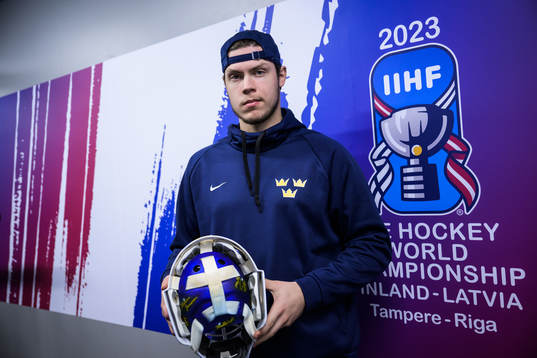 Goaltender Jesper Wallstedt of Sweden poses with his helmet