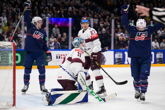 Goaltender Arturs Silovs and Oskars Cibulskis of Latvia