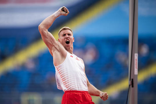 Piotr Lisek of Poland celebrates as he