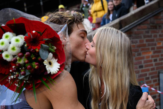 Armand Duplantis of Sweden kisses his girlfriend Desire