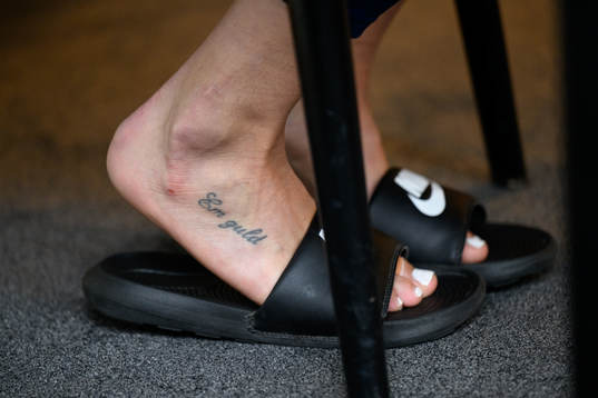 Nathalie Björn with a tattoo with the text "EM Guld"