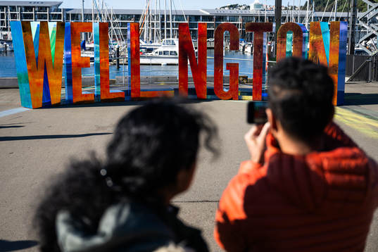 People photograph letters spelling ”Wellington”