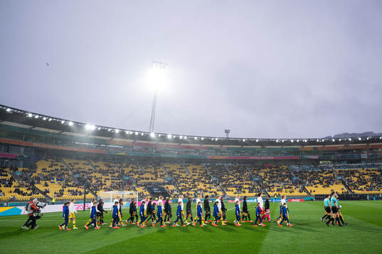 Players of Sweden and of South Africa enter the picth