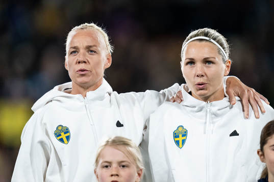 Caroline Seger and goalkeeper Jennifer Falk of Sweden