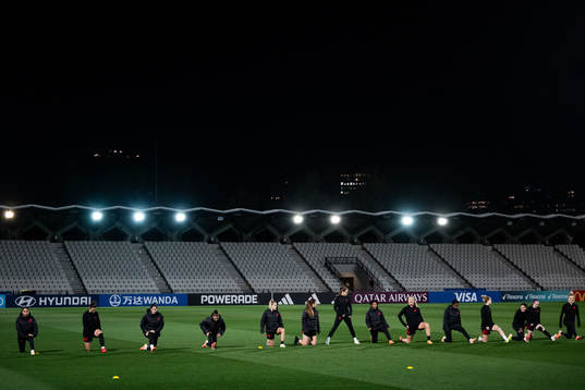 Players warm up at a training session with the women's