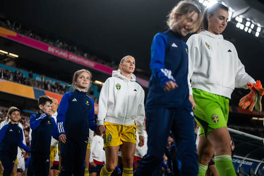 Jonna Andersson and goalkeeper Zecira Musovic of Sweden