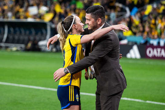 Kosovare Asllani of Sweden celebrates with TV-expert Bojan