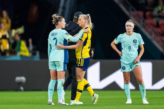 Steph Catley of Australia and Stina Blackstenius of Sweden