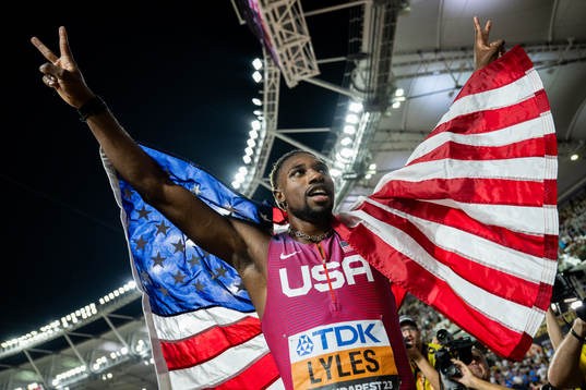 Noah Lyles of USA celebrates