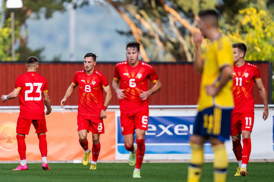 Ivan Nikolov of North Macedonia celebrates with team mates
