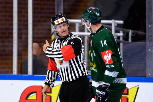 Referee Mikael Nord and Victor Ejdsell of Färjestad