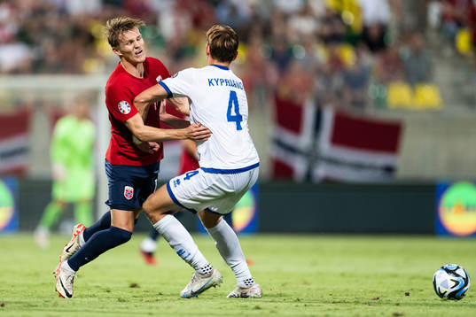 Martin Ødegaard of Norway and Hector Kyprianou of Cyprus