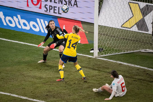 Goalkeeper Zecira Musovic and Nathalie Björn of Switzerland