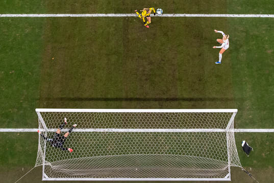 goalkeeper Zecira Musovic and Nathalie Björn of Sweden