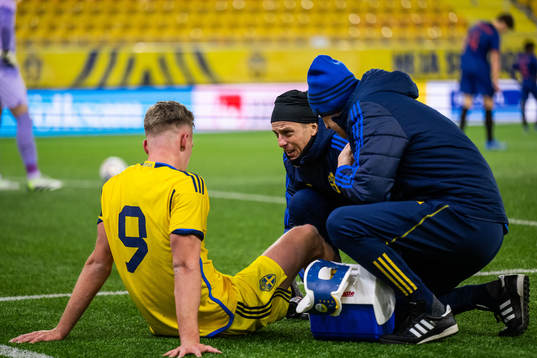 Joel Voelkerling Persson of Sweden is seen to by medical