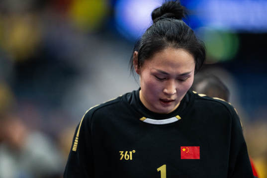 Goalkeeper Chang Lu of China looks dejected