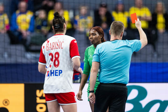 Fanta Keita of Senegal looks dejected as she receives a red