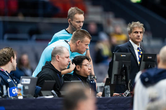 Referees Mads Hansen and Jesper Madsen in a video review
