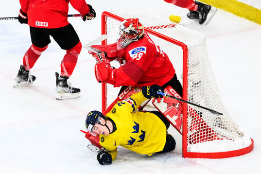 Jonathan Lekkerimäki of Sweden and goaltender Alessio