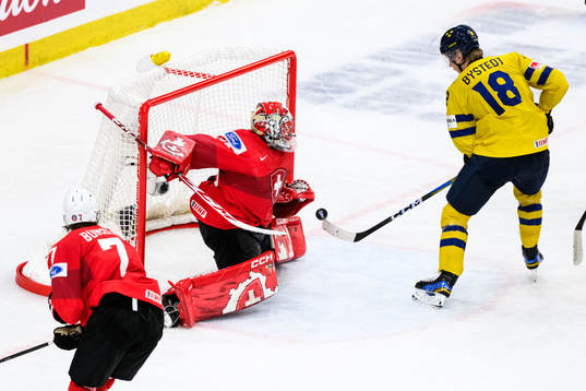 Goaltender Alessio Beglieri of Switzerland and Filip