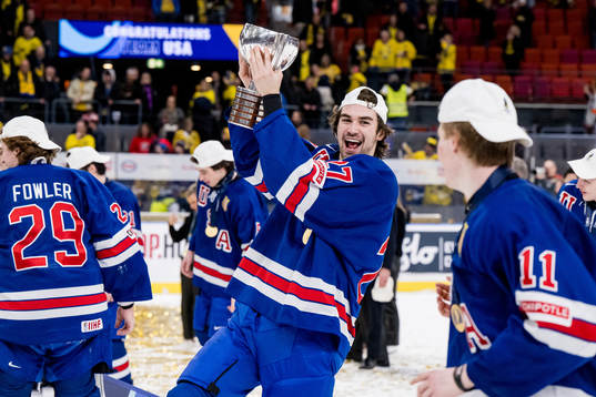 Gavin Hayes of USA celebrates with the trophy