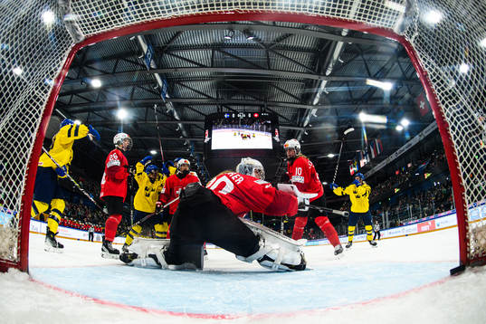 Isabelle Leijonhielm of Sweden scores 1-0 behind goaltender