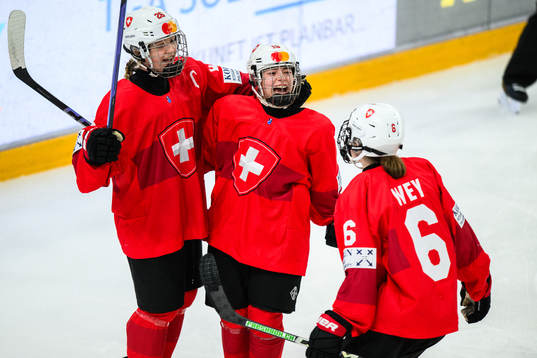 Elisa Dalessi of Switzerland celebrates with teammates