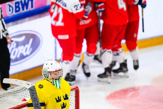 Goaltender Maja Helge of Sweden looks dejected