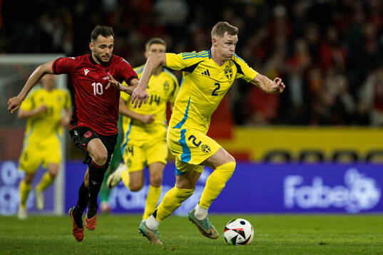 Nedim Bajrami of Albania and Emil Krafth of Sweden
