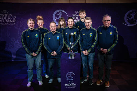 Hosts of team Sweden poses for a picture