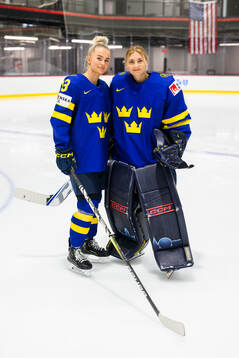 Wilma Sundin and goaltender Ida Boman of Sweden at a team