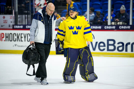 Doctor Wille Ahnberg and goaltender Emma Söderberg of
