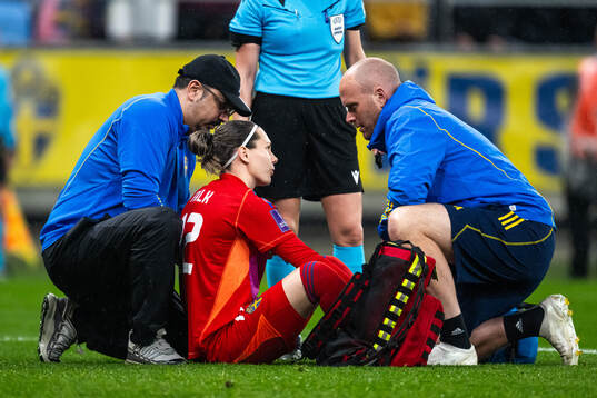 Goalkeeper Jennifer Falk of Sweden in pain