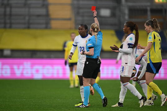 Vicki Becho of France receives a red card