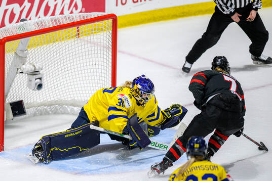 Goaltender Emma Söderberg of Sweden and Laura Stacey of