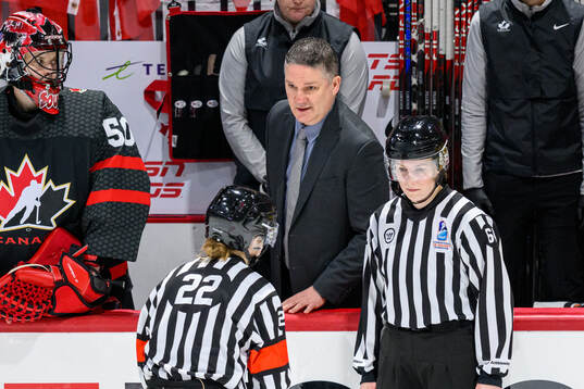 Head coach Troy Ryan of Canada in discussion with Referee