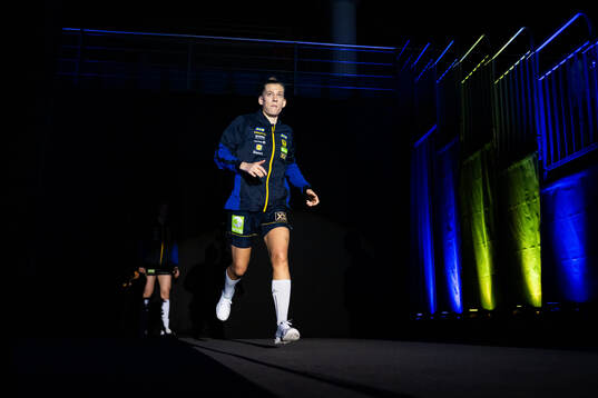 Nathalie Hagman of Sweden enter the pitch