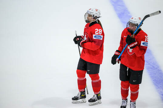 Alina Marti and Stefanie Wetli of Switzerland look dejected