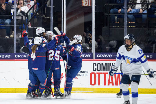 Laila Edwards of USA celebrates with teammates