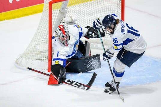 Goaltender Sanni Ahola and Petra Nieminen of Finland