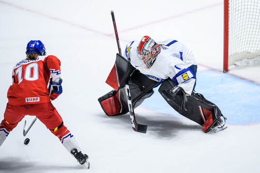 Denisa Krizova of Czech Republic and goaltender Sanni Ahola