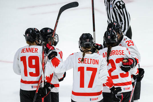 Erin Ambrose of Canada celebrates with teammates