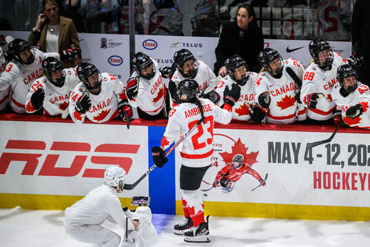 Erin Ambrose of Canada celebrates scoring 0-1