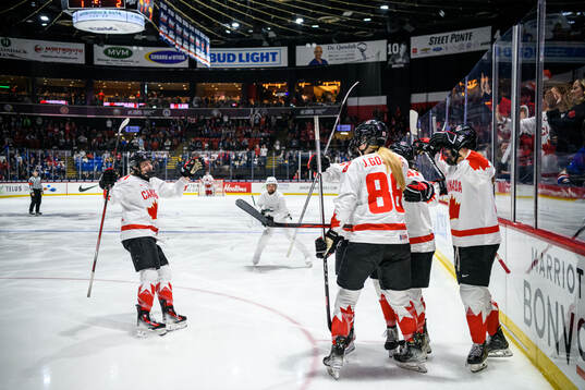 Julia Gosling of Canada celebrates with teammates